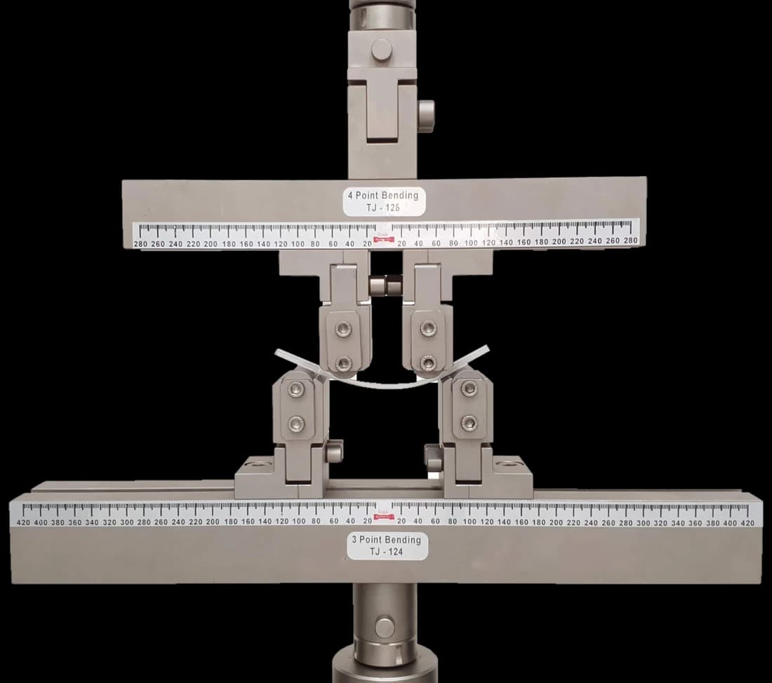 Four point bending fixture with two inner and two outer supports