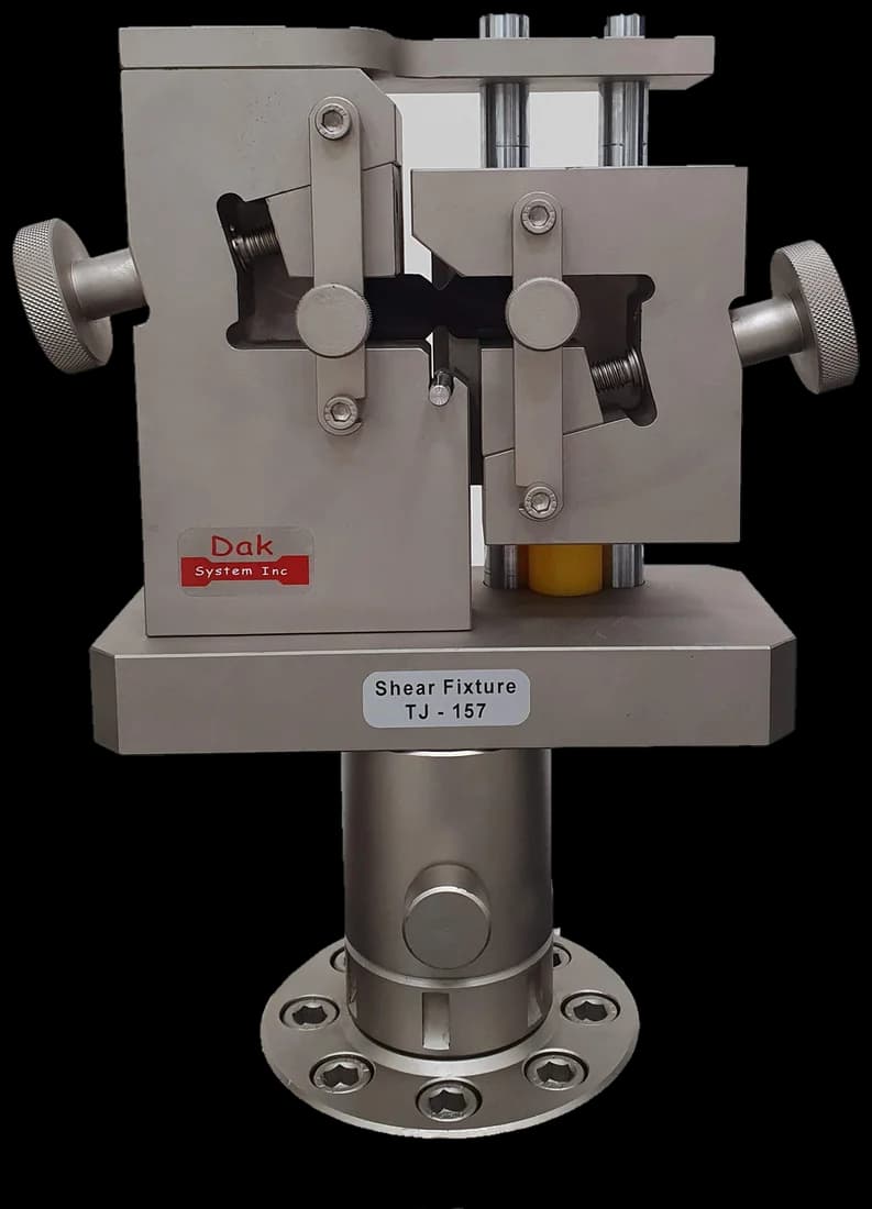 Shear fixture mounted on a load frame adapter
